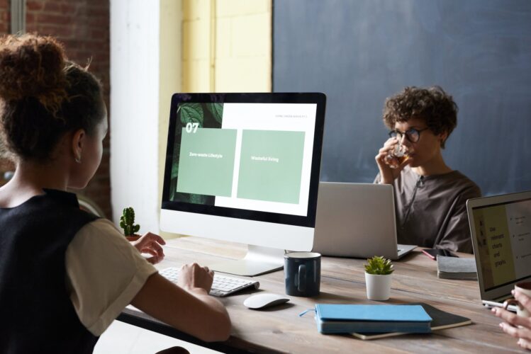 photo of woman using computer