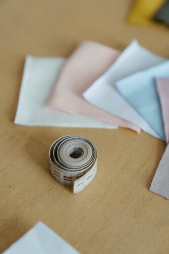 black and silver round coin on white paper